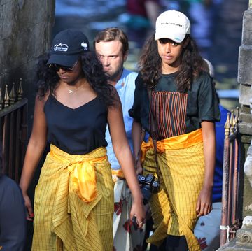 bali, indonesia june 27 sasha centre l and malia centre r, daughters of former us president barack obama, visit tirtha empul temple at tampaksiring village in gianyar on the indonesian resort island of bali on june 27, 2017 barack obama kicked off a 10 day family holiday in indonesia that will take in bali and jakarta, the city where he spent part of his childhood, officials said on june 24 photo by jepayona delitaanadolu agencygetty images