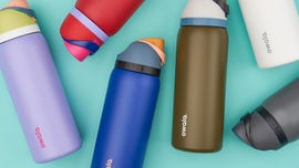a group of different colored owala water bottles