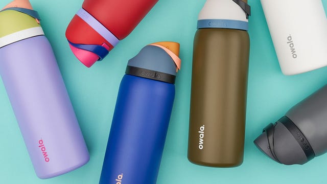 a group of different colored owala water bottles
