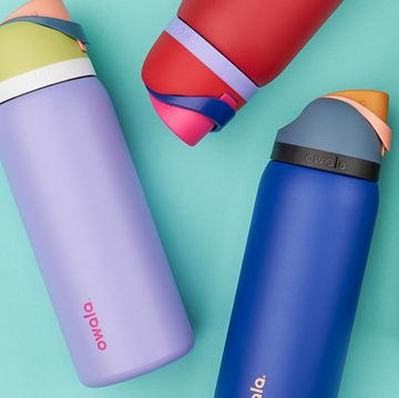 a group of different colored owala water bottles