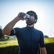 mid adult male road biker enjoying water break are their benefits to dry january