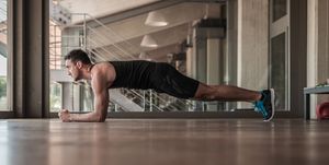 Mid adult man doing plank exercise