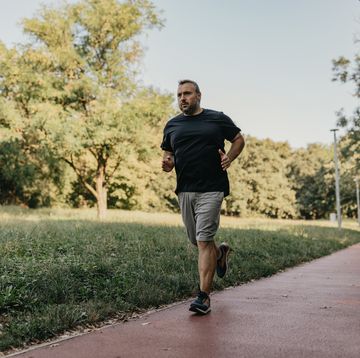 mid adult man running outdoor