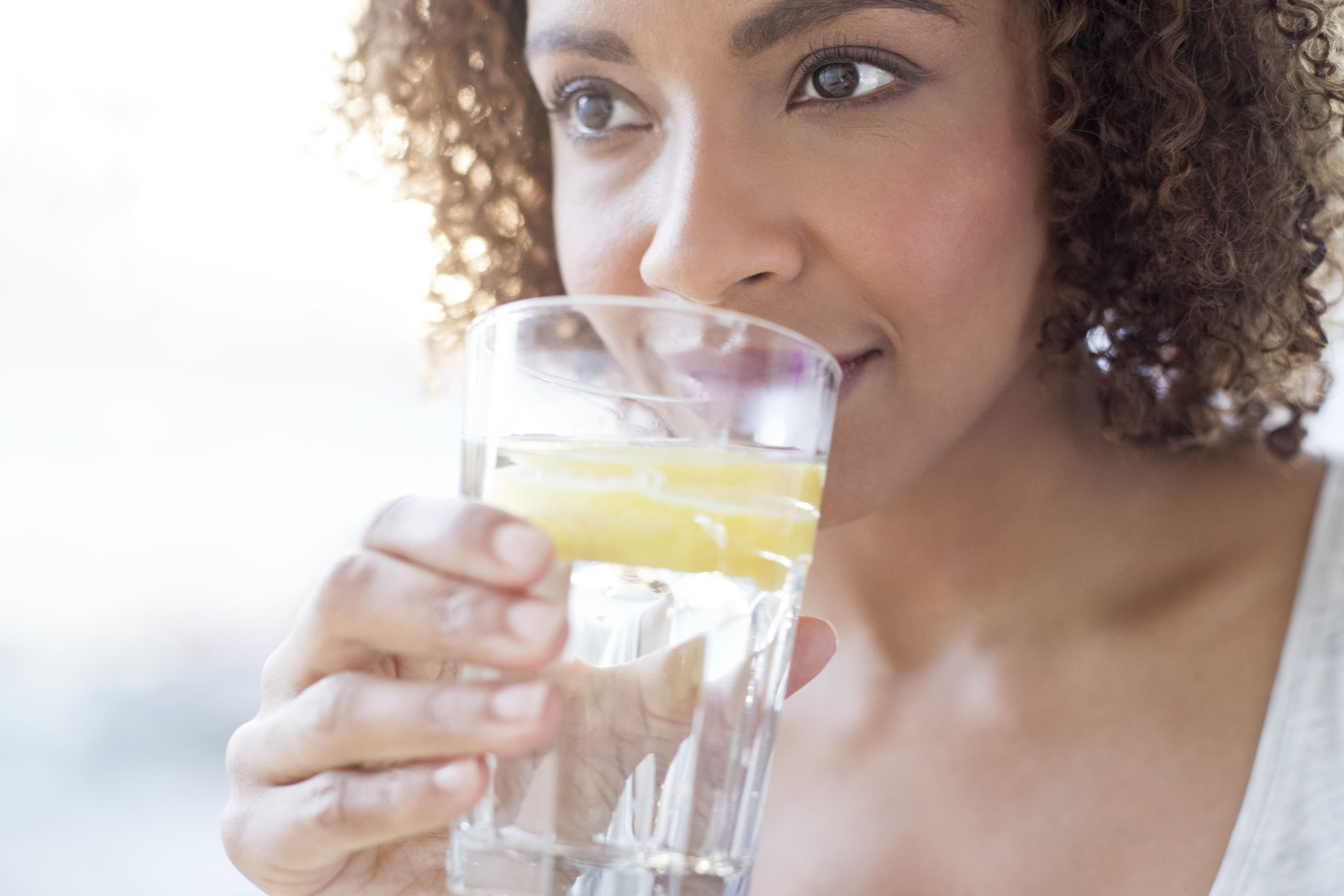 Royalty-Free photo: Clear drinking glass with body of water