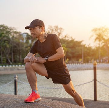 middle aged man warm up, preparing to run and exercise.
