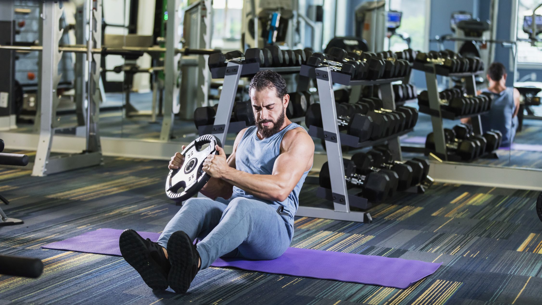 https://hips.hearstapps.com/hmg-prod/images/middle-eastern-man-exercising-at-the-gym-lifting-royalty-free-image-1690294922.jpg?crop=0.95265xw:1xh;center,top