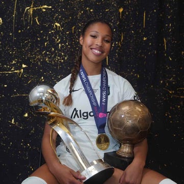 a person holding a trophy a person holding a trophy