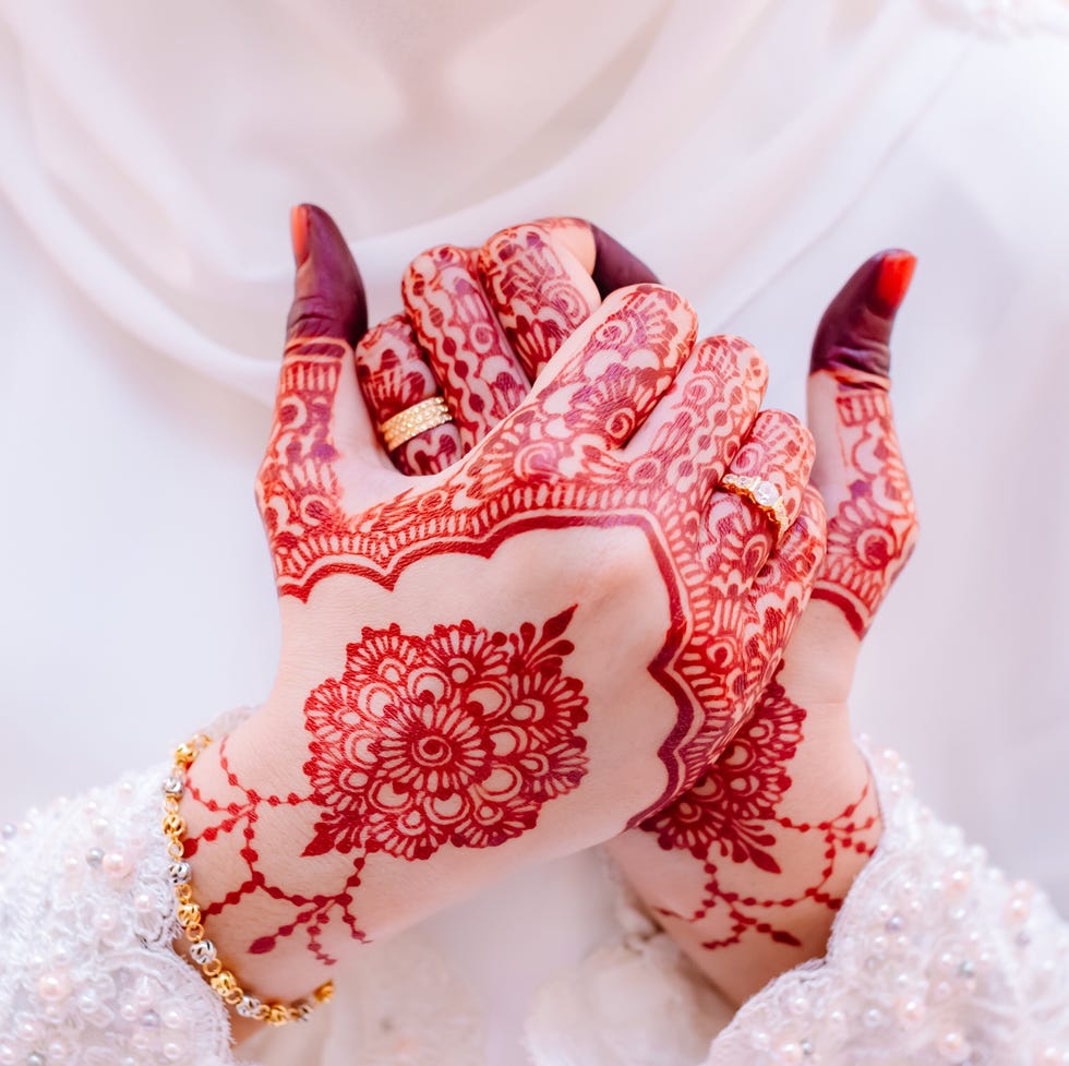 midsection of bride with henna tattoo