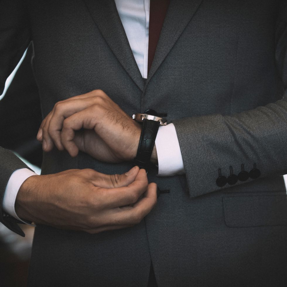 Midsection Of Businessman Wearing Wristwatch