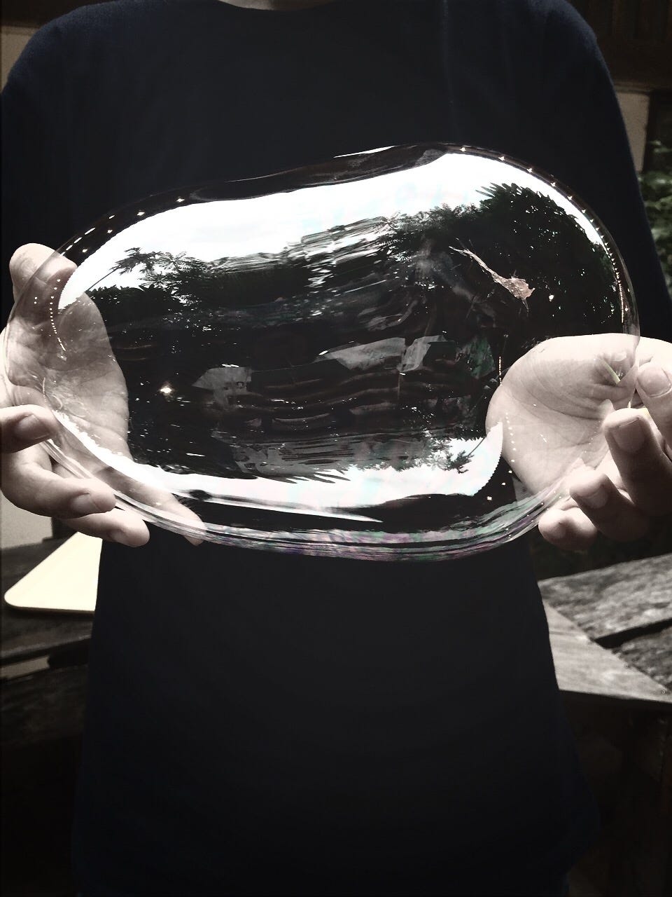 midsection-of-man-holding-big-bubble-outdoors-royalty-free-image-1580929491.jpg