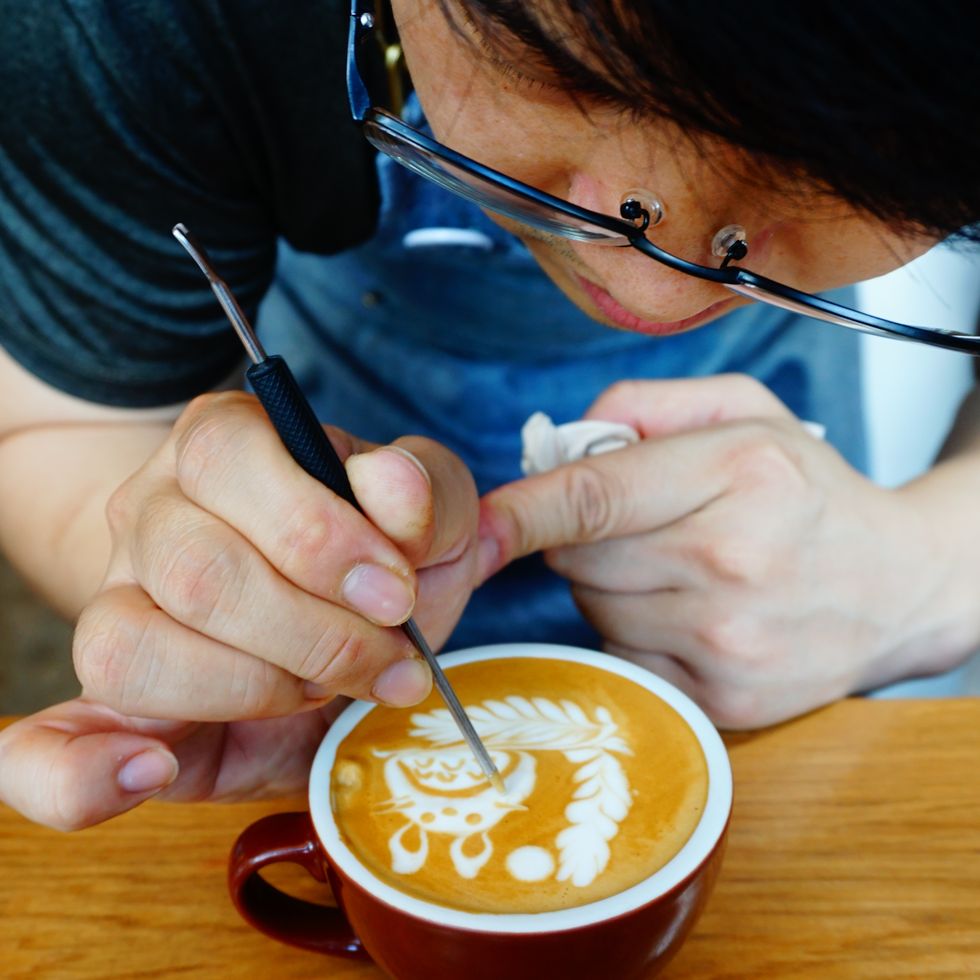 https://hips.hearstapps.com/hmg-prod/images/midsection-of-man-making-froth-art-in-coffee-cup-on-royalty-free-image-1664376921.jpg?crop=0.668xw:1.00xh;0.112xw,0&resize=980:*