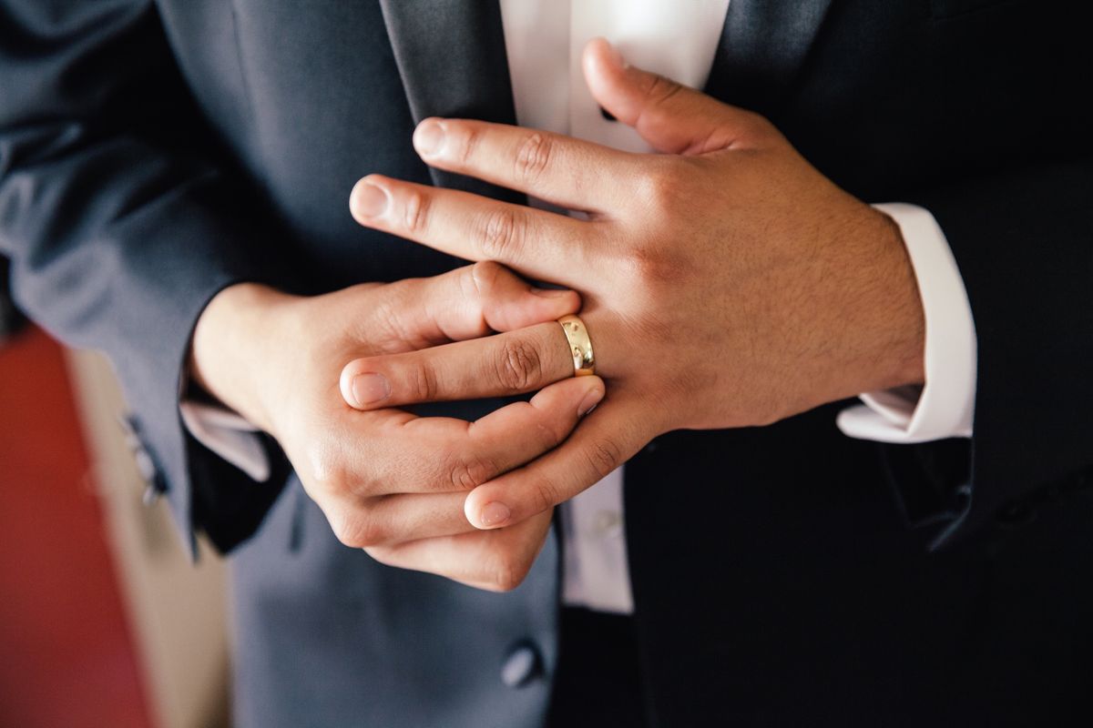 Midsection Of Man Wearing Wedding Ring
