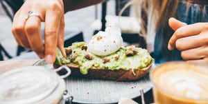 Midsection Of Woman Having Food And Drink And Sidewalk Cafe