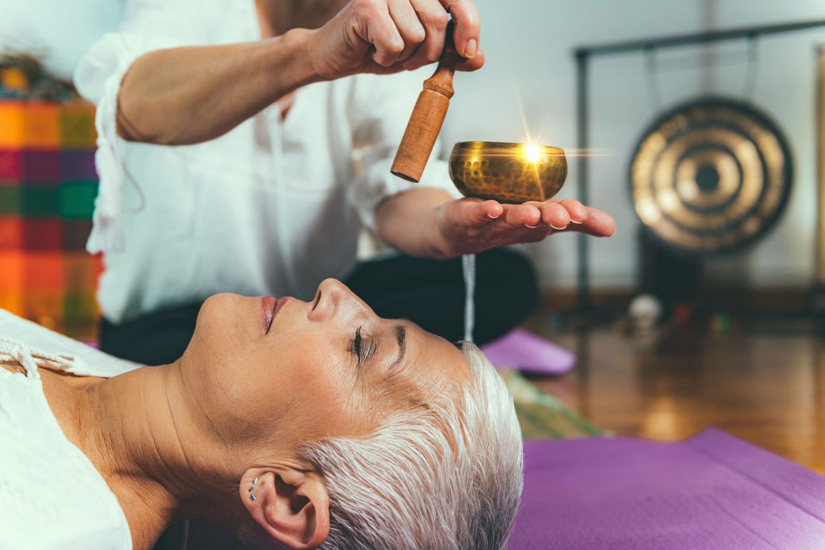 https://hips.hearstapps.com/hmg-prod/images/midsection-of-woman-playing-singing-bowl-for-royalty-free-image-1582579474.jpg?crop=0.670xw:1.00xh;0.0946xw,0&resize=1200:*