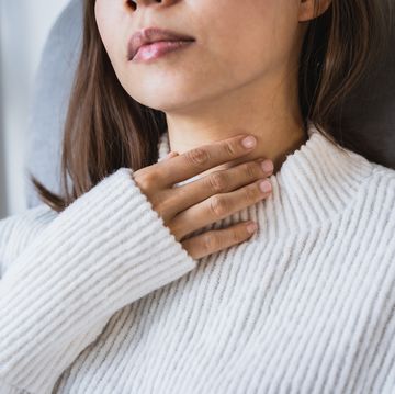 midsection of woman wearing white sweater