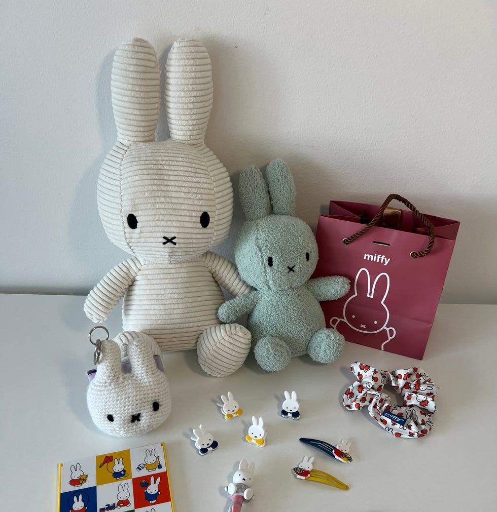 collection of miffy plush toys and accessories on a table