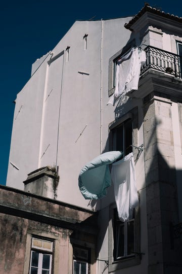 a white building with a flag on the roof