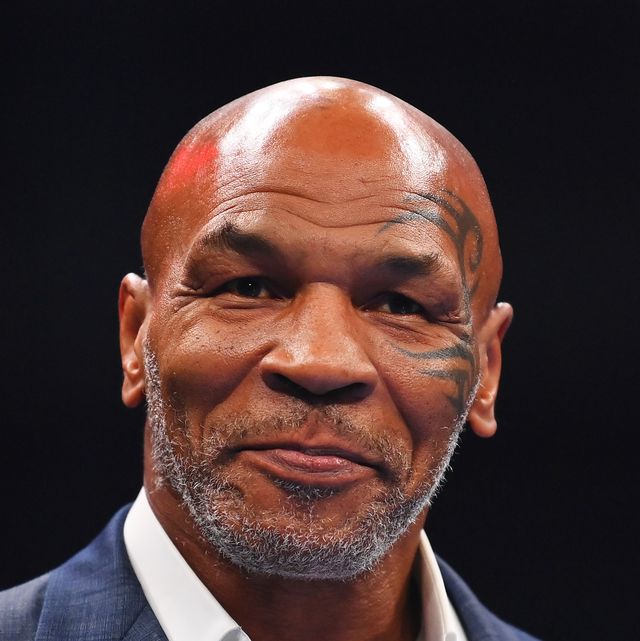 mike tyson in front of a dark background