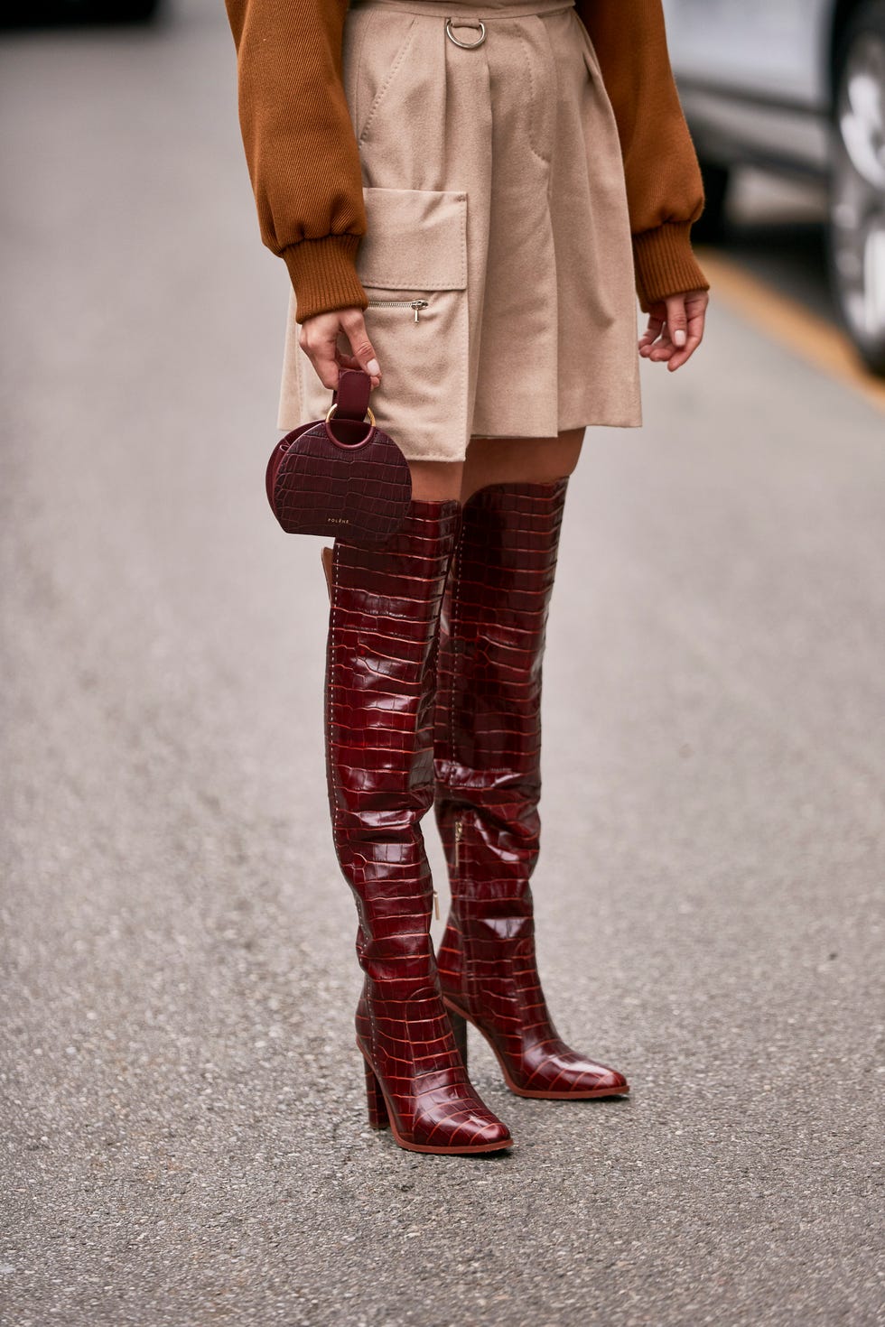 Footwear, Clothing, Street fashion, Boot, Leg, Brown, Standing, Fashion, Riding boot, Knee, 