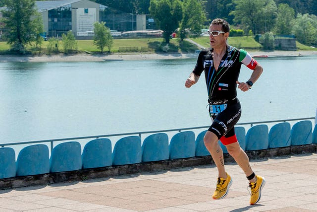 a man running on a sidewalk