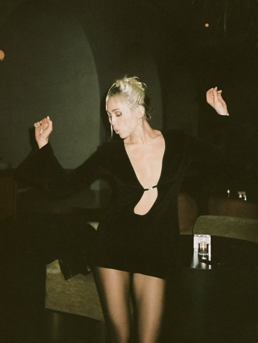 Black Miley Cyrus Porn - Miley Cyrus wears plunging mini dress with keyhole cutout