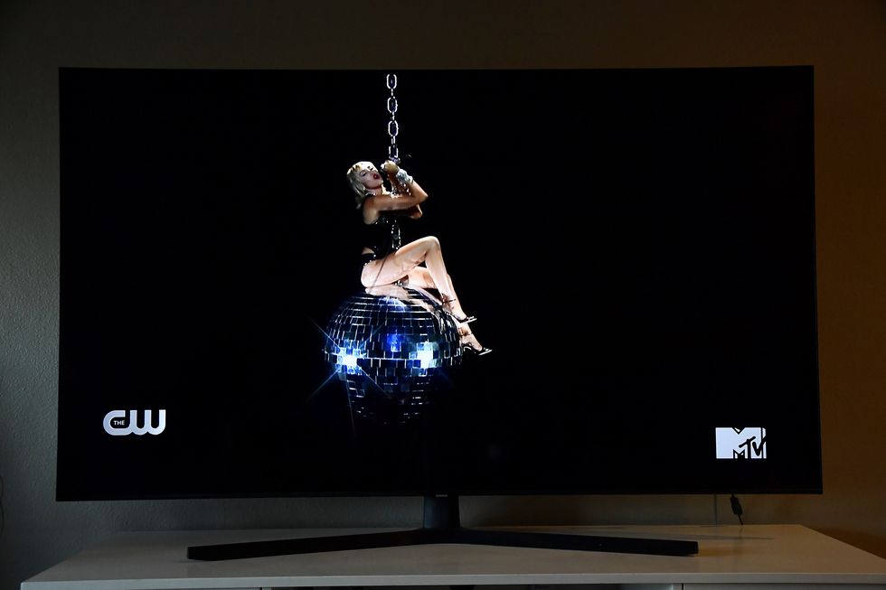 new york, ny   august 30 in this photo illustration, miley cyrus, viewed on a television screen, performs during the 2020 mtv video music awards broadcast on august 30, 2020 in  new york city  photo illustration by frazer harrisongetty images