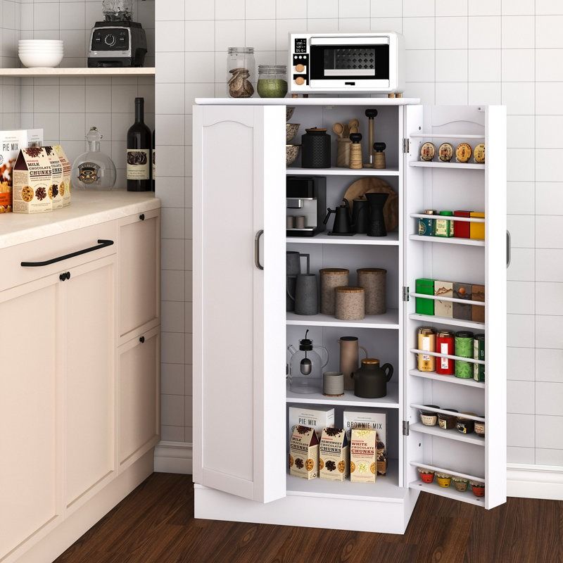 a white shelving unit with objects on it