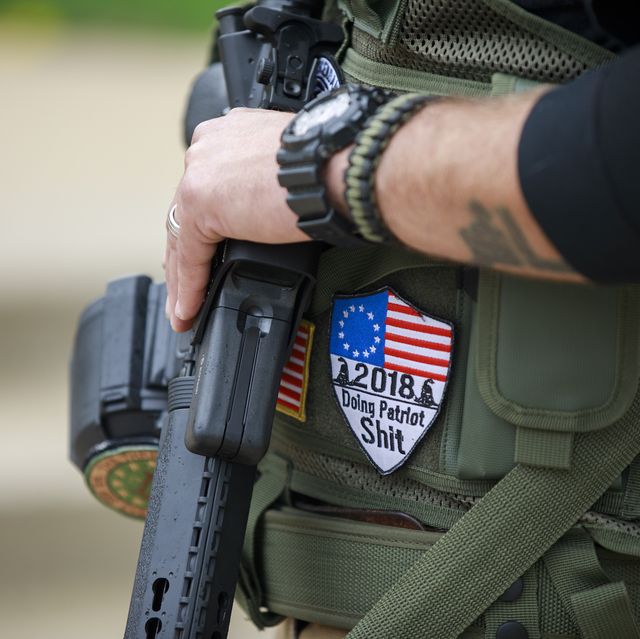 indianapolis, indiana, united states   20190427 a member of the aaf iii militia does security during the pro freedom rally at the indiana statehouse during the during the third day of the national rifle association convention being held nearby  a patch reads, "doing patriot shit" photo by jeremy hogansopa imageslightrocket via getty images