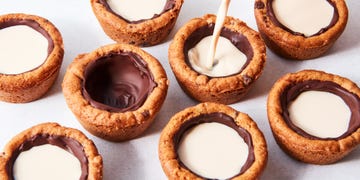 mini cookie cups lined with chocolate and filled with milk