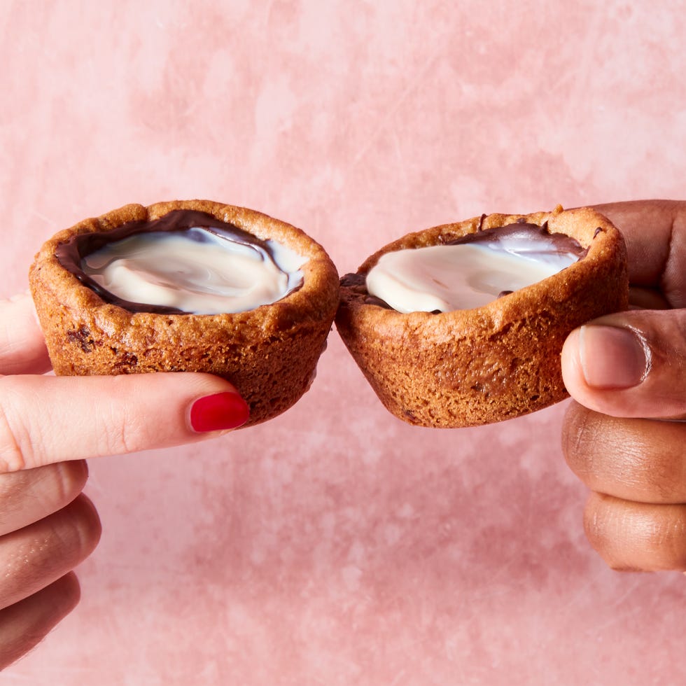 mini cookie cups lined with chocolate and filled with milk