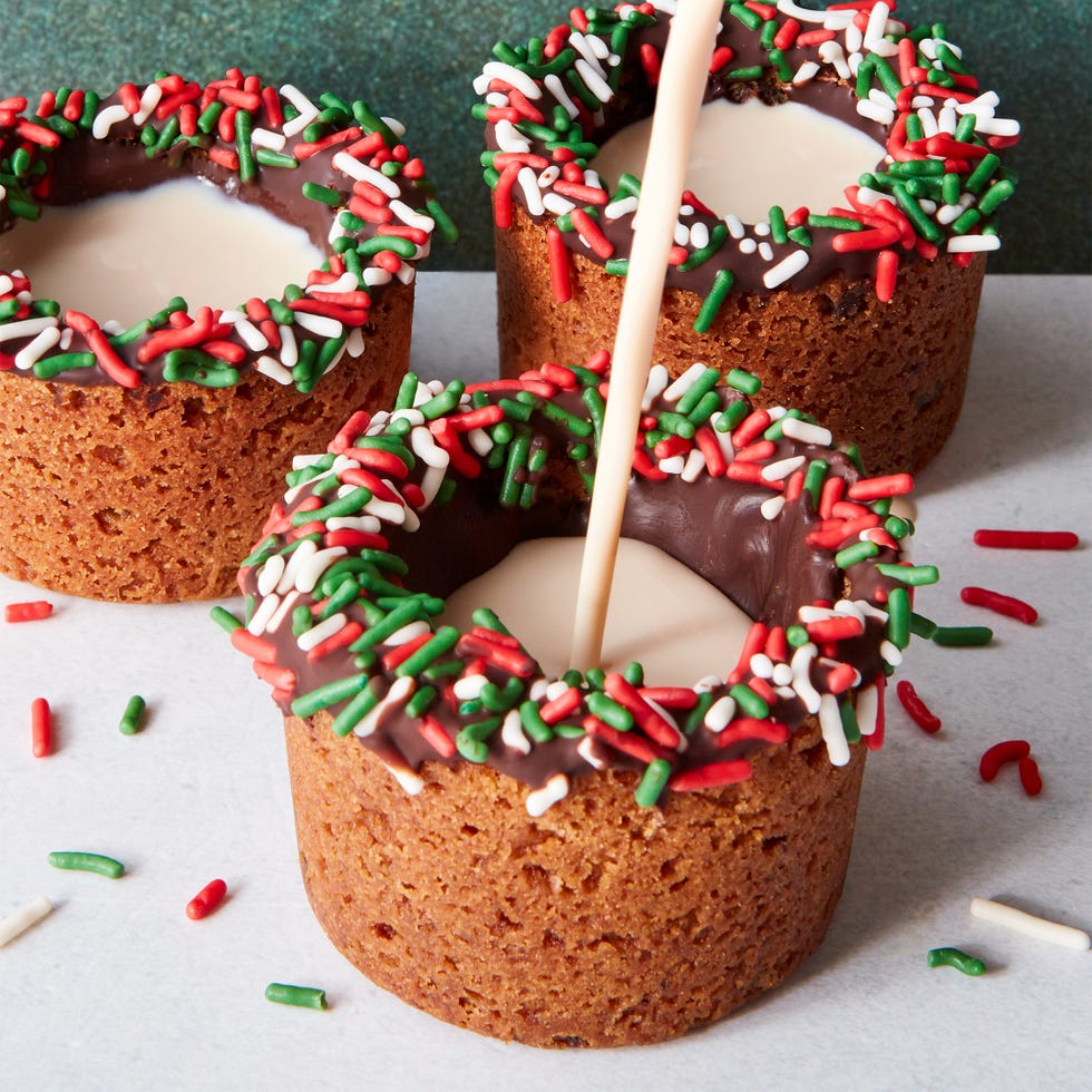 cookie cups filled with milk and baileys with a chocolate sprinkle rim