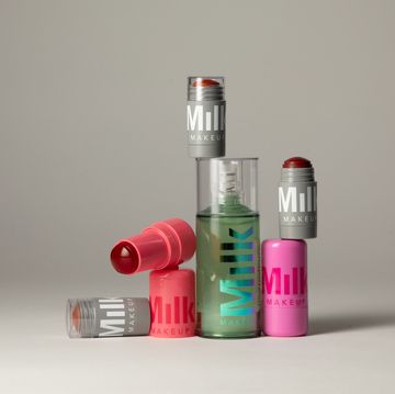 a group of different colored bottles