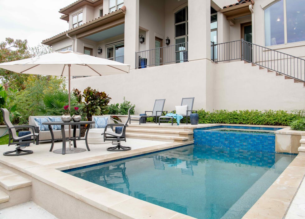 caged pool with various outdoor living zones