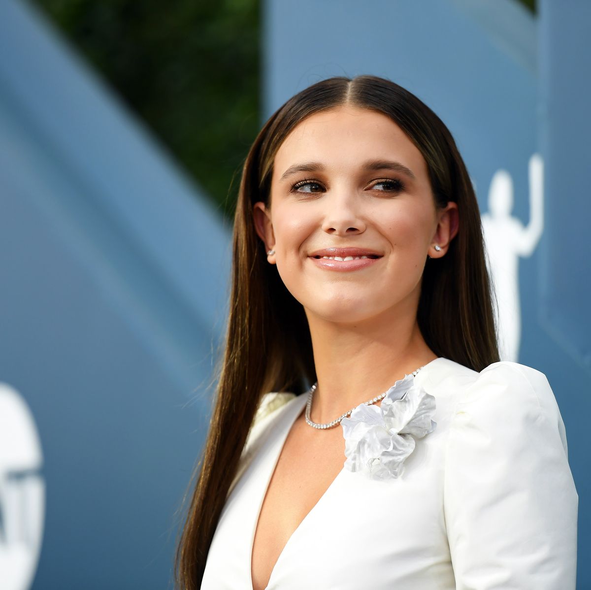 Millie Bobby Brown looks angelic as she hits the SAG Awards red carpet in a  pristine white ensemble