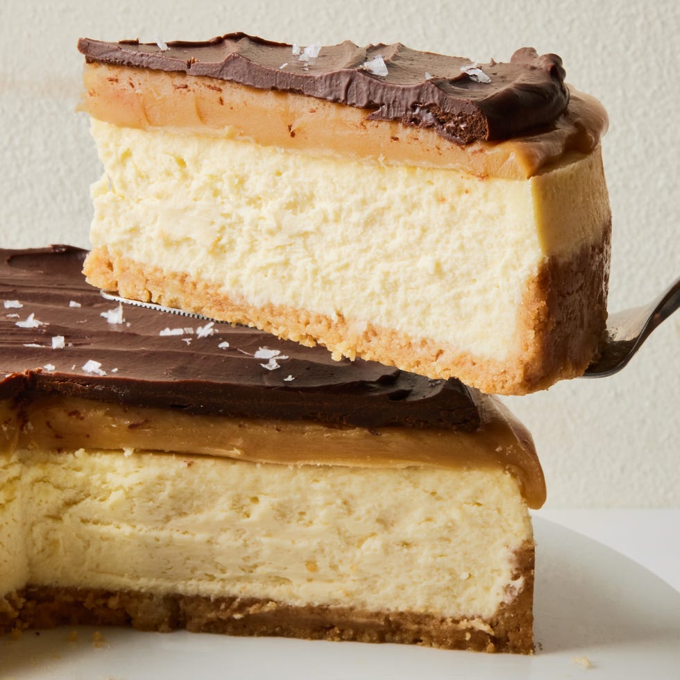 layered shortbread cheesecake covered in chocoalte