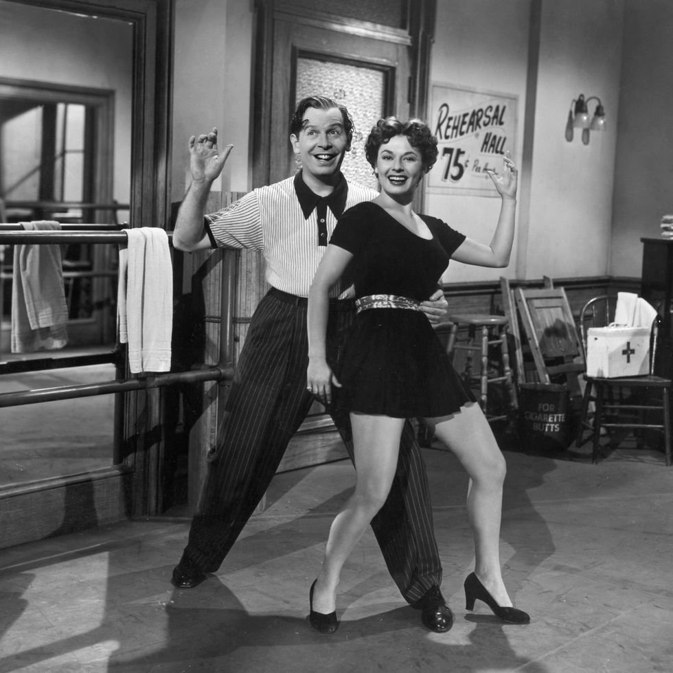 milton berle and ruth roman dance in a scene from the 1949 comedy, always leave them laughing.