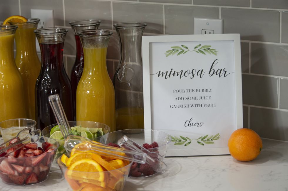 a mimosa bar with freshly sliced fruit