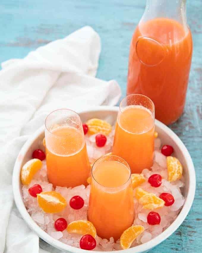 holiday mimosa punch glasses in ice bowl