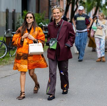 two women in street style day 4 copenhagen fashion week springsummer 2024 wearing ballet flats to illustrate a guide to the best flats for wide feet