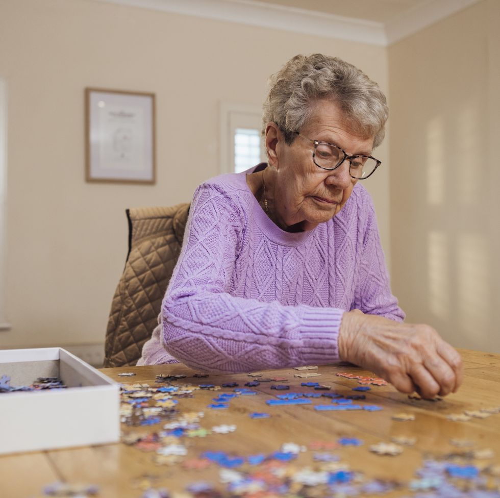 a woman does puzzles