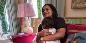 an instagram photo of mindy kaling holding he daughter