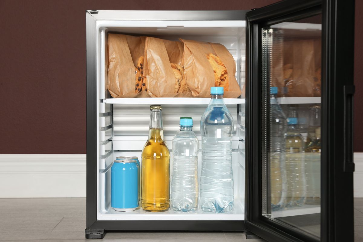 mini bar filled with food and drinks indoors, closeup