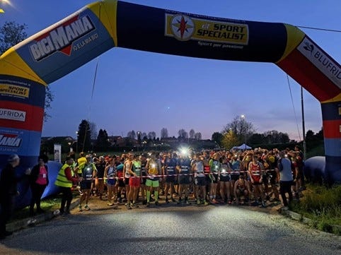 starting line at a running event with participants lined up