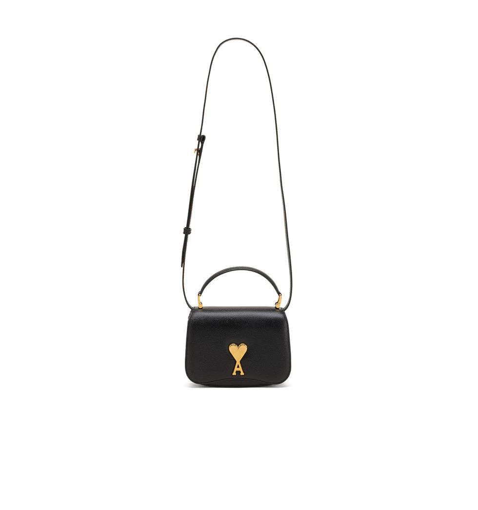 a black handbag with a yellow logo