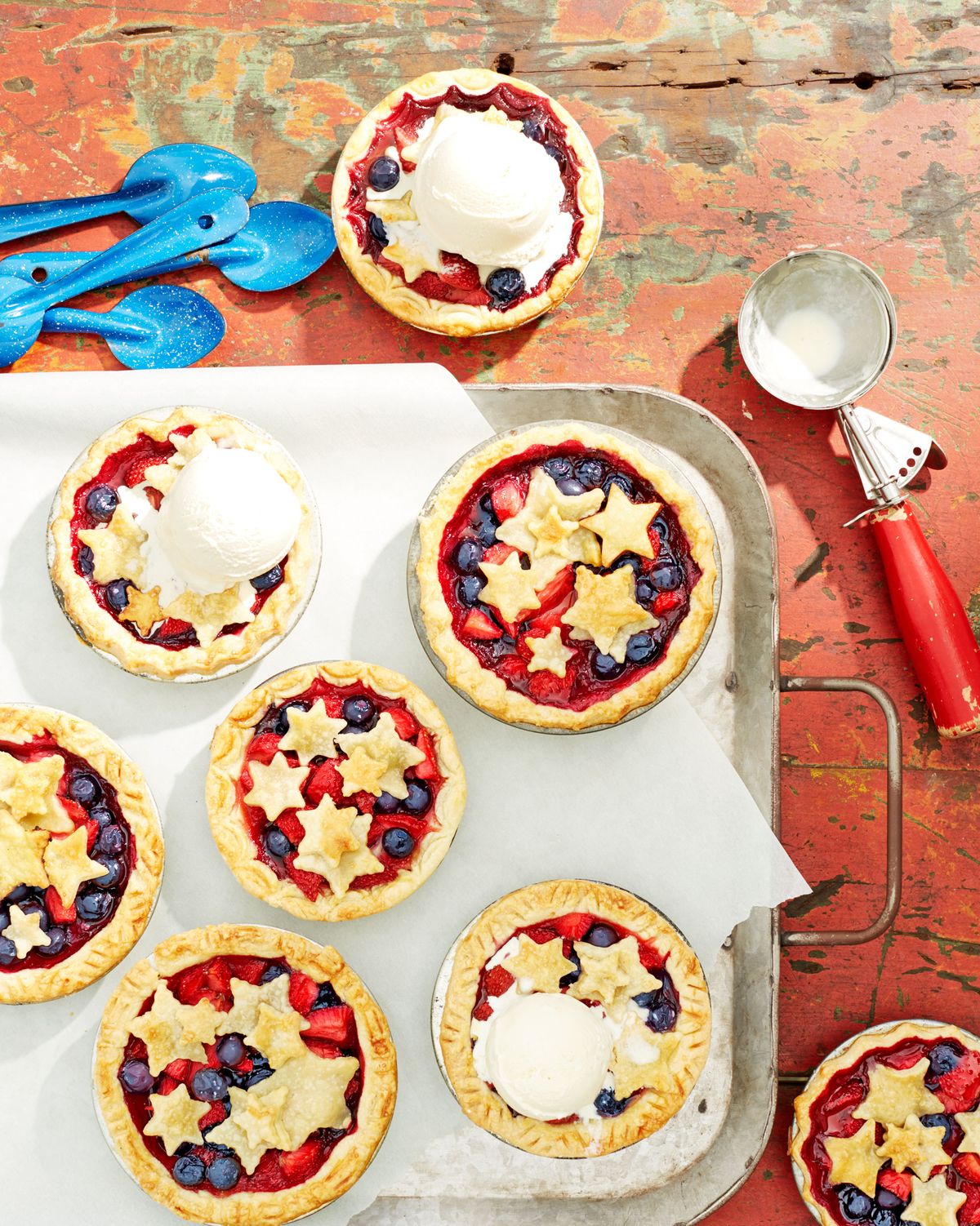 mini stars berry pies on a vintage tray