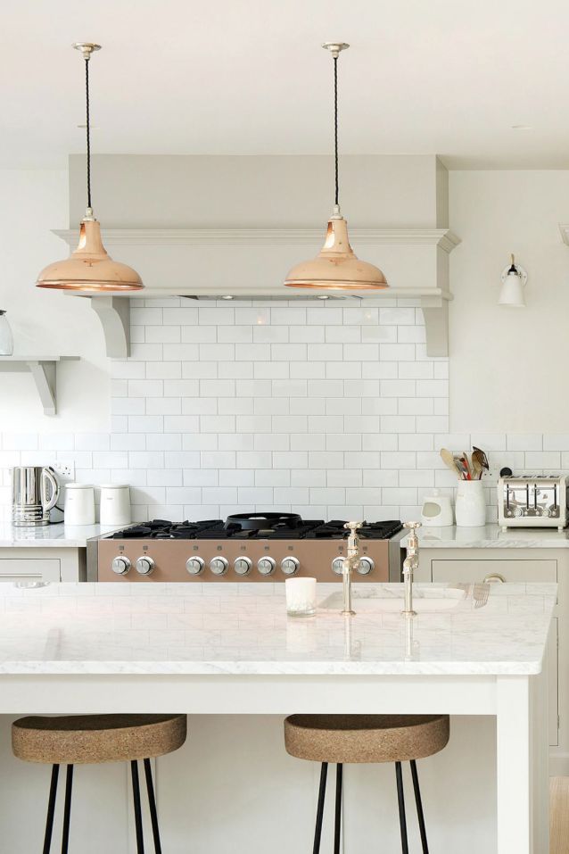 classic white kitchen with two bronze pendants