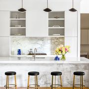 modern white kitchen with marble backsplash