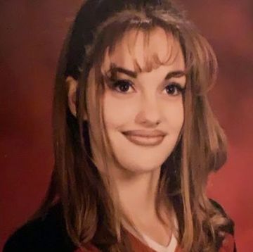 minka kelly's yearbook photo, in which the actress has 90s teased bangs and brown lipstick