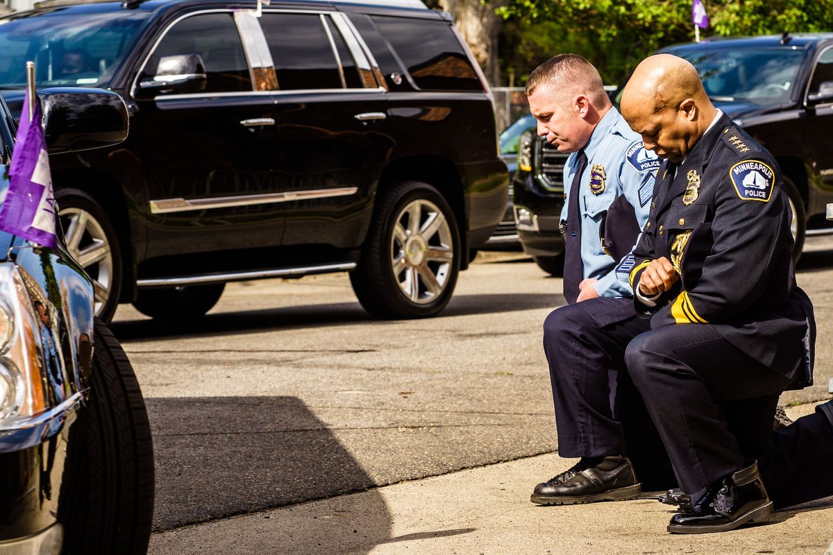 topshot   minneapolis police chief medaria arradondo r kneels as the remains of george floyd are taken to a memorial service in his honor on june 4, 2020, in minneapolis, minnesota   on may 25, 2020, floyd, a 46 year old black man suspected of passing a counterfeit $20 bill, died in minneapolis after derek chauvin, a white police officer, pressed his knee to floyd's neck for almost nine minutes photo by kerem yucel  afp photo by kerem yucelafp via getty images