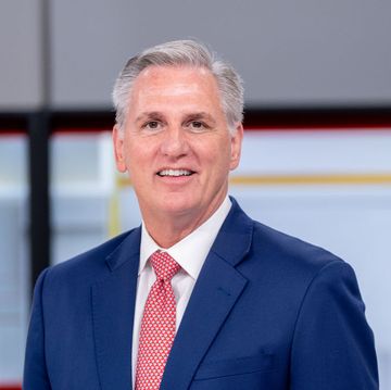 kevin mccarthy wearing a blue suit and smiling on a television program